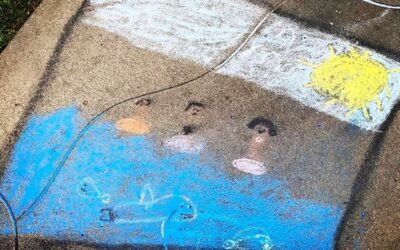 Chalk art 'melted' by rain on our front sidewalk. The first activity we did at home w/ Nalani on her first night with us was chalk on the sidewalk. Some many mixed emotions that day, for all of us. #dadlife