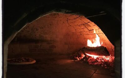 Our pizza cooking in the wood fired oven at TriBecca Allie in Sardis, MS. #foodporn #meekjourno