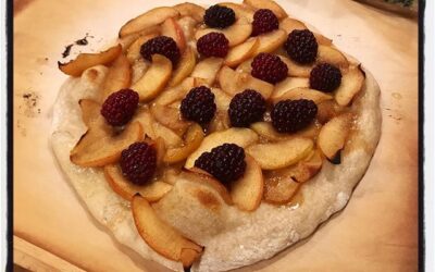 Dessert pie: compound butter from cinnamon rolls with sautés apples and raspberries. #pizzaclub