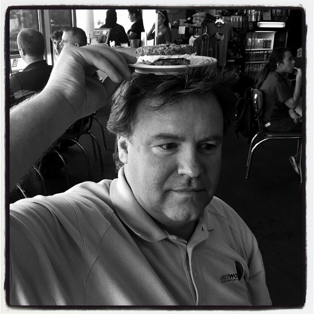 Man with cookie sandwich on his head. #iphoneography